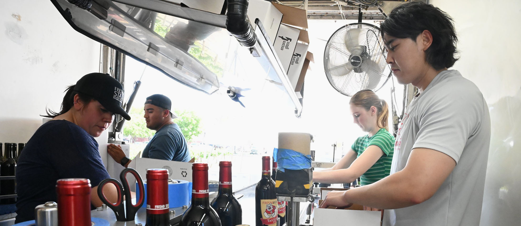 Students bottling wine